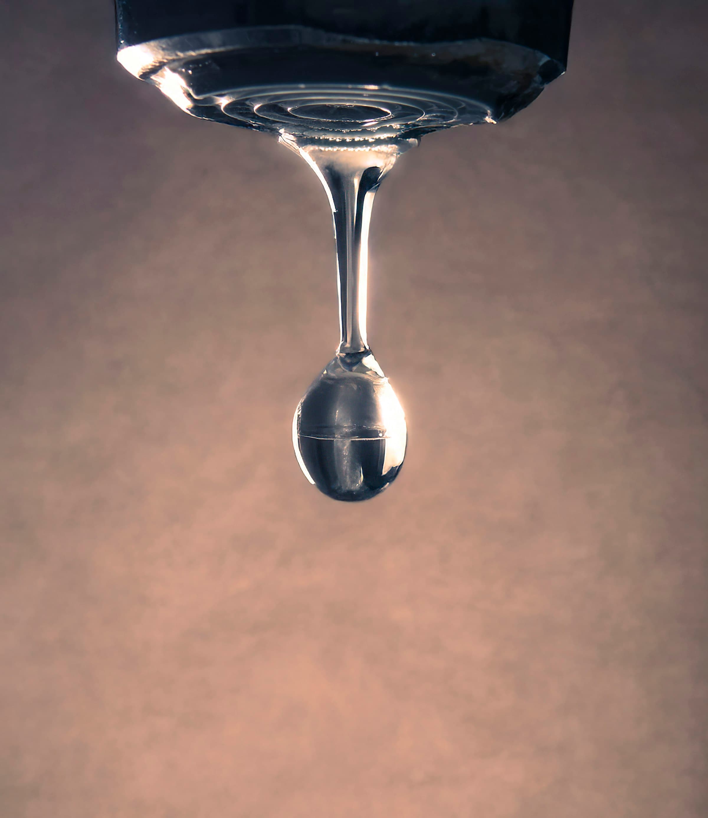 Macro water droplet on Grohe faucet